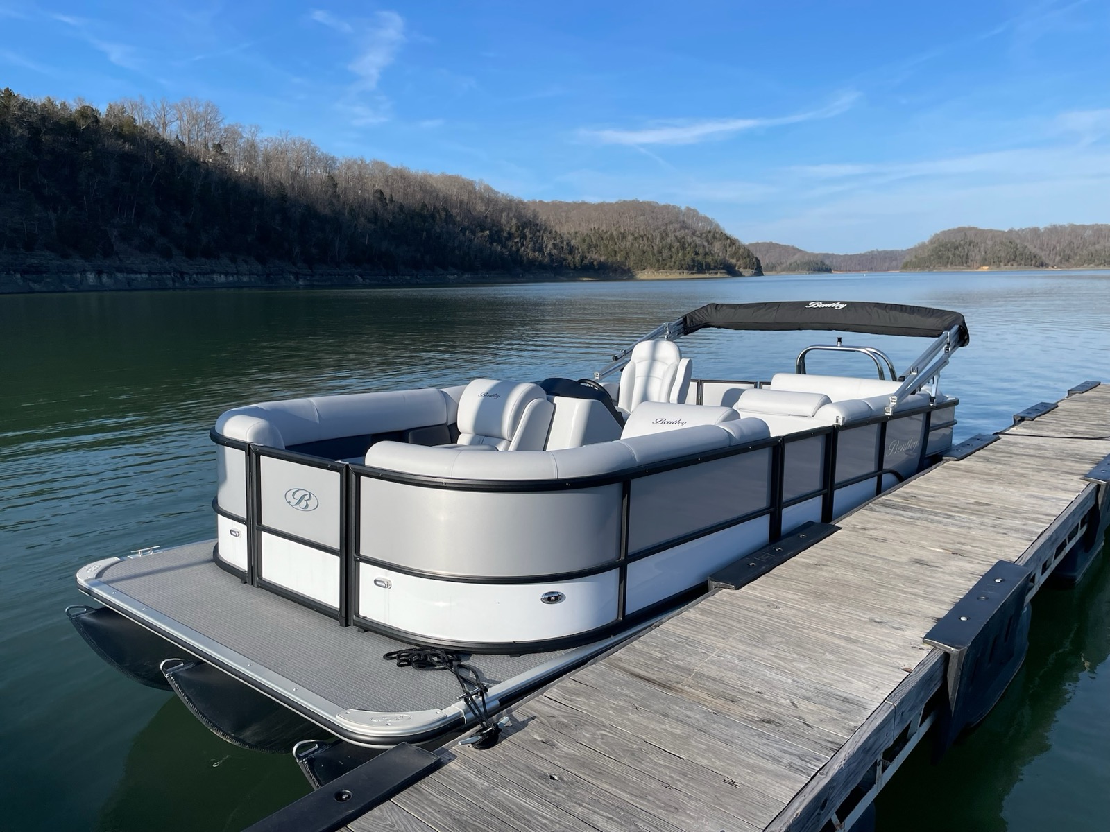 Bentley pontoon docked at Lake Cumberland